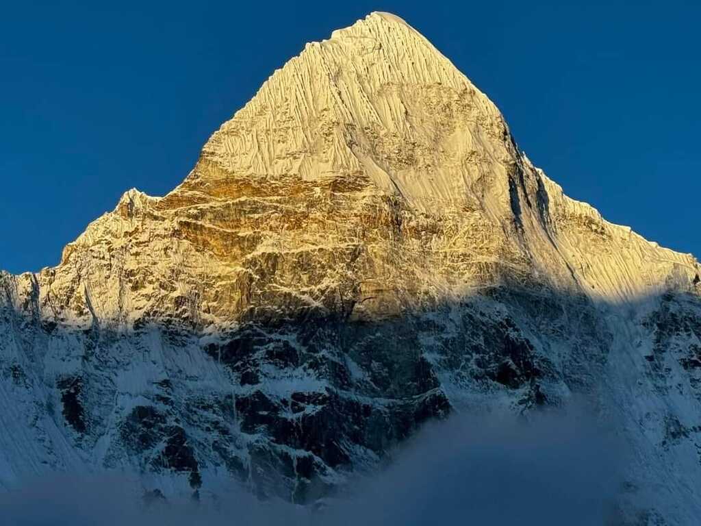 View Of Kanchanjunga Himalaya at Evening with sunlight rays cutting snows
